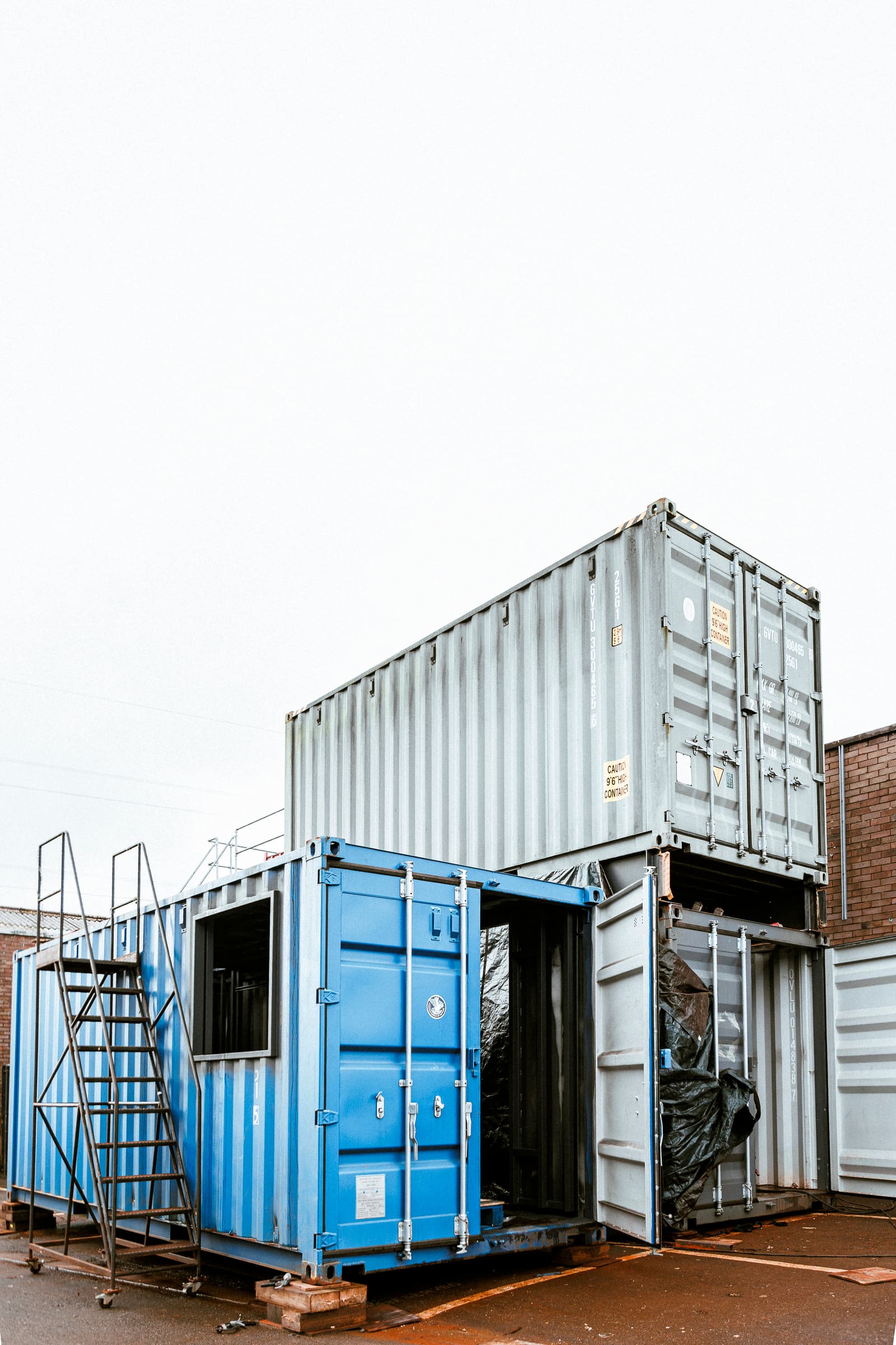The Ground Force Boeing 727 suspended above stacked shipping containers at Skyline Park, Bristol.