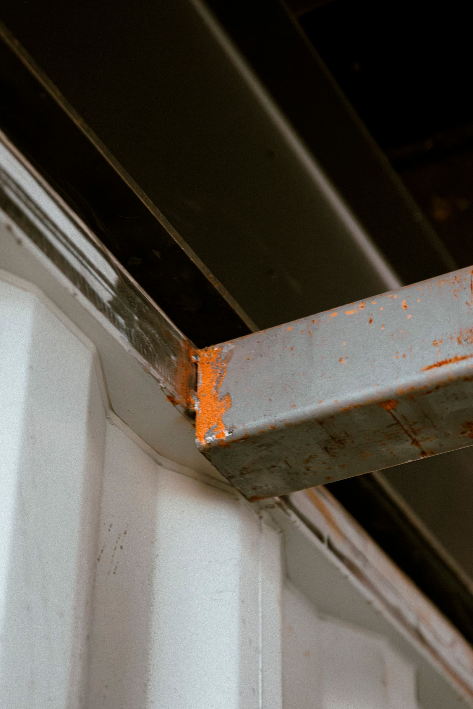 Detail of weathered steel and reclaimed material textures at Ground Force.
